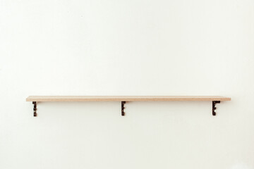 Empty wooden shelf on white cement wall background, product display montage