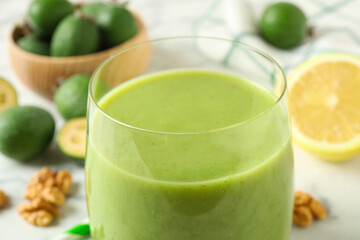 Fresh feijoa smoothie in glass, closeup view