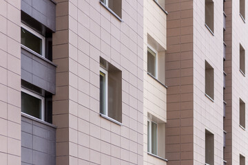 Fragment residential apartment with flat building exterior. Detail of New luxury house and home complex.