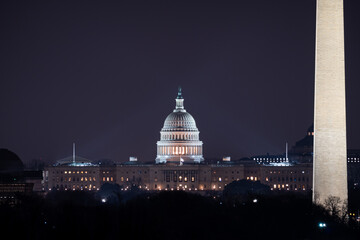 View of the US Capitol building and the Washington Monument at night