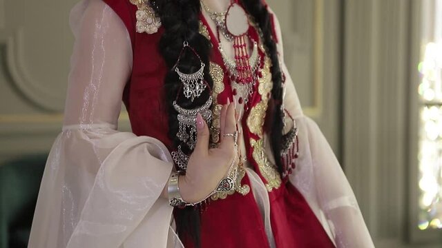 Translation results
Asian girl in national costume. Kyrgyz national women's clothing with embellishments.