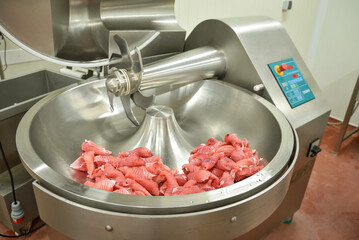 Cutter for chopping meat at a meat processing plant. Industrial cutter at the factory where...