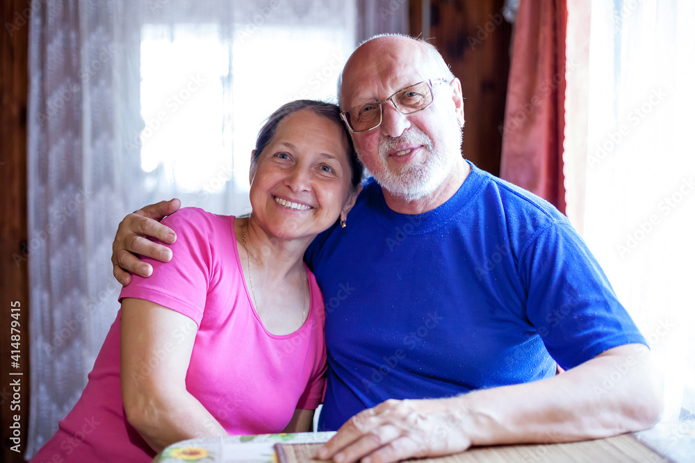 Poster  cute mature couple   in   kitchen