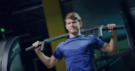 Attractive Fitness Man Closeup Lat Pull Down Training For The Upper Back Sports Center Active Lifestyle Determination Health Focused Fitness Concept