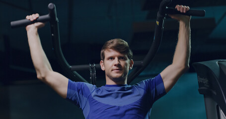 Attractive Fitness Man Closeup Lat Pull Down Training For The Upper Back Sports Center Active Lifestyle Determination Health Focused Fitness Concept