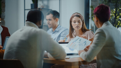Diverse Multi-Ethnic Group of Professional Businesspeople Meeting in the Modern Office Conference...