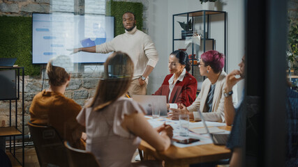 Office Conference Room Meeting: Male Chief Executive Talking to a Diverse Team of Professional Businesspeople. Creative People Listen to CEO Discuss Design, Data Analysis, Plan Marketing Strategy