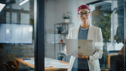 Modern Office: Portrait of Beautiful Authentic Specialist with Short Pink Hair Standing, Holding...