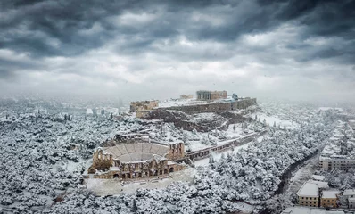 Gardinen The Parthenon Temple and the Herodion Theater at the Acropolis of Athens, Greece, with ice and snow during a winter snowstorm © moofushi