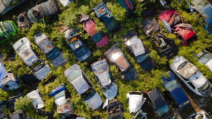 Scrapyard Aerial View. Old rusty corroded cars in car junkyard. Car recycling industry from above.
