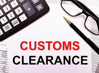 On the reports there is a calculator, glasses, a pen and a notebook with the inscription CUSTOMS...