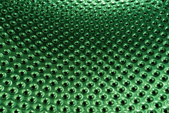 Metal surface with many holes. Perforated metal sheet