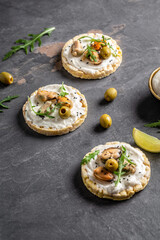Bruschetta with mussels, cheese, crisp breads Mussels bruschetta, toast with soft cheese and arugula, banner, top view, vertical image, place for text