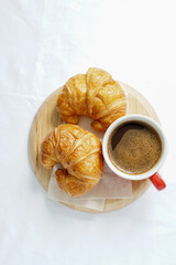croissant and cup of coffee
