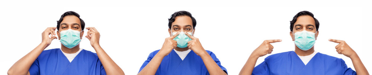 healthcare, profession and medicine concept - indian doctor or male nurse in blue uniform putting on face protective medical mask for protection from virus disease over white background
