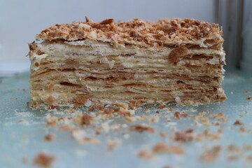 napoleon layered cake in a cut with crumbs
