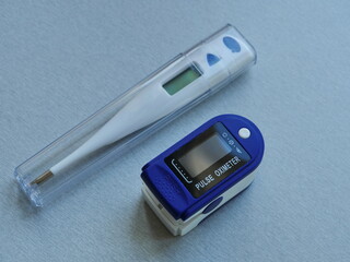 thermometer, and pulse oximeter close-up, still life