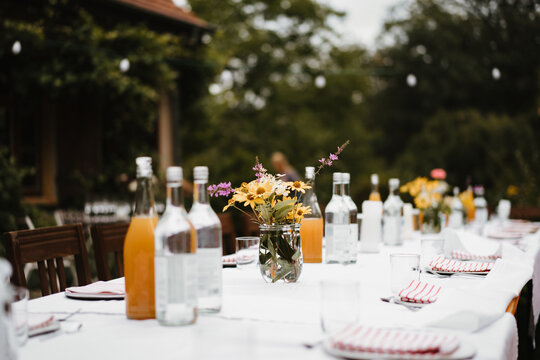 photo of an outdoor long table at a wedding