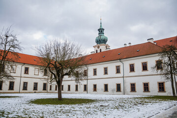 Baroque white benedictine monastery Brevnov with church, Medieval Basilica of St. Marquette, Garden...