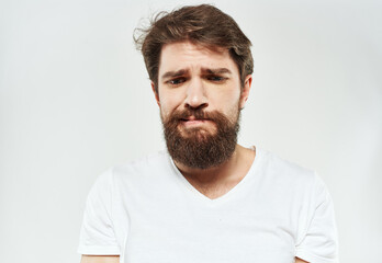 Obraz premium emotional man with beard puzzled look on light background