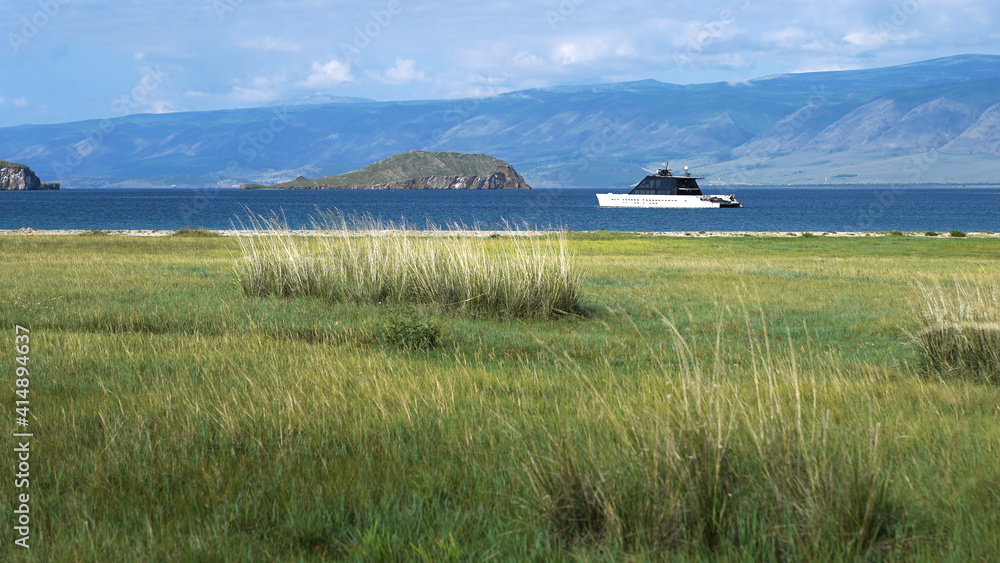 Wall mural view from grass field to yacht and small and hyge rocky hilly islands. europe. harmony of human and 