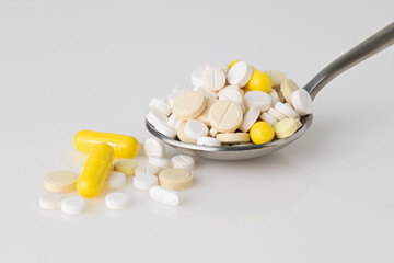 full spoon of various pills