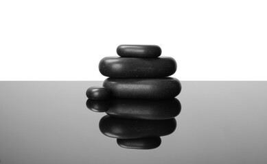 Stack of spa stones on mirror surface