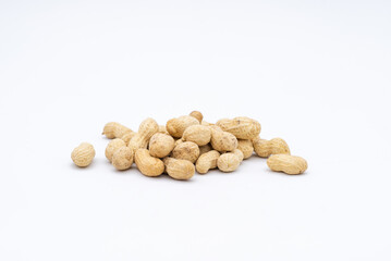 Fototapeta na wymiar A pile of peanuts on a white background