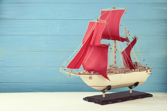 Beautiful ship model on white wooden table. Space for text