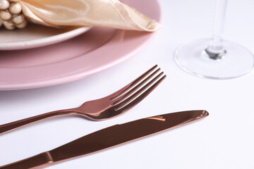 Beautiful table setting on white background, closeup