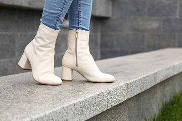 Woman wearing stylish leather shoes outdoors, closeup