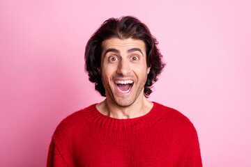 Portrait of young handsome cheerful excited shocked amazed surprised man with open mouth isolated on pink color background