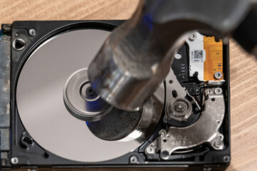 Hard drive being smashed with hammer while running