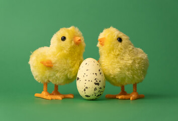 Creative for Easter. Chickens toy with yellow Easter eggs in a basket.