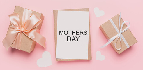Fototapeta na wymiar Gifts with note letter on isolated pink background, love and valentine concept with text mothers Day