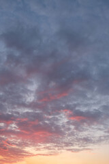 Fototapeta na wymiar Golden sunset clouds in the blue sky in the sun.