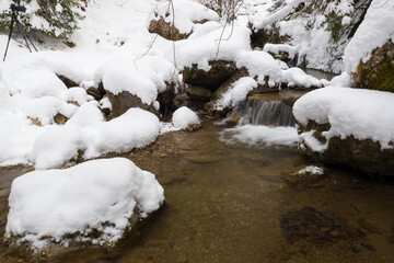 Mountain stream in winter, snow in Homole, Poland