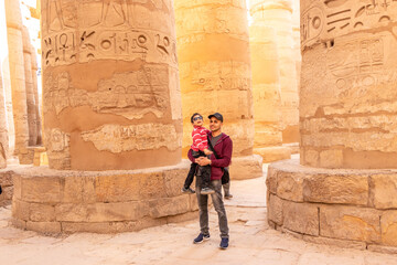 father and his son visit Luxor temple in Luxor, Egypt (ancient Thebes). 