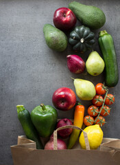Organic vegetables and fruits in reusable paper bag. Zero waste concept. Healthy lifestyle. 