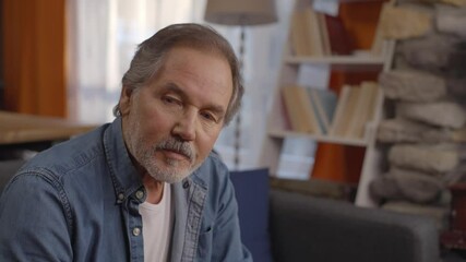 The thoughtful old man looks the other way. Old age, the concept of being alone.