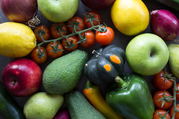Fresh organic fruits and vegetables on a table. Healthy eating concept. Vegetarian meal ingredients top view photo. 
