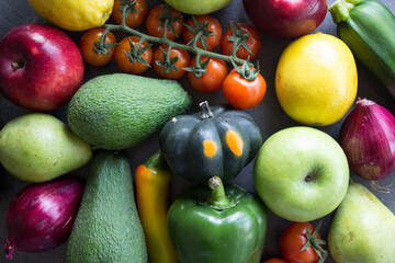 Fresh organic fruits and vegetables on a table. Healthy eating concept. Vegetarian meal ingredients top view photo. 