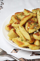 Polish dish kopytka served at the table