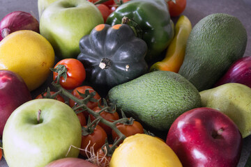Fresh organic fruits and vegetables on a table. Healthy eating concept. Vegetarian meal ingredients top view photo. 