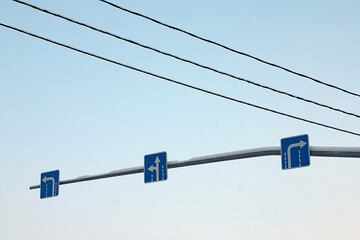 road signs indicating the direction of traffic in the lanes