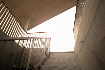 creative angle for a modern and refined concrete architectural structure. Metal stairs 