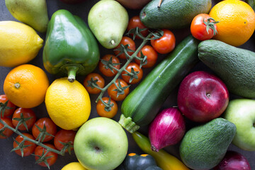 Fresh organic fruits and vegetables on a table. Healthy eating concept. Vegetarian meal ingredients top view photo. 