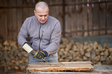 Carpenter working a walnut wood