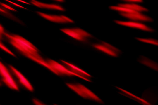 Blur colorful neon light leaks on black background. Defocused illuminated abstract futuristic texture for using over photos as overlay or screen filter