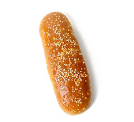 baked oval hot dog bun, baked goods sprinkled with sesame seeds and isolated on white background